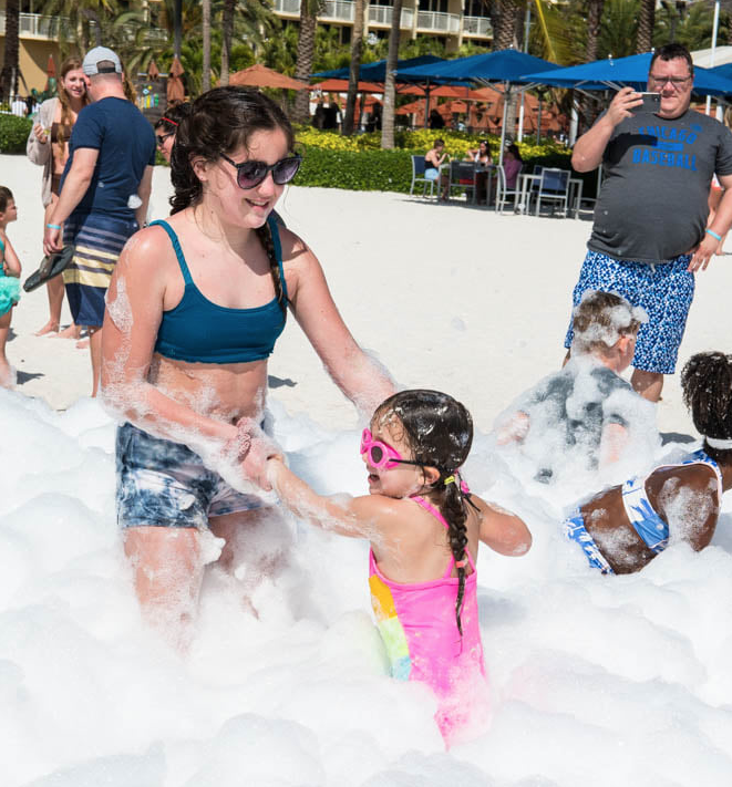 mom and daughter at foam party