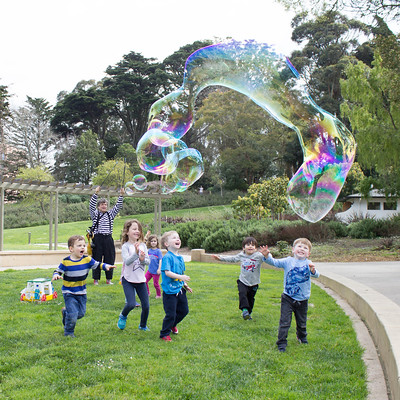 Kids in a park at a Bubble party
